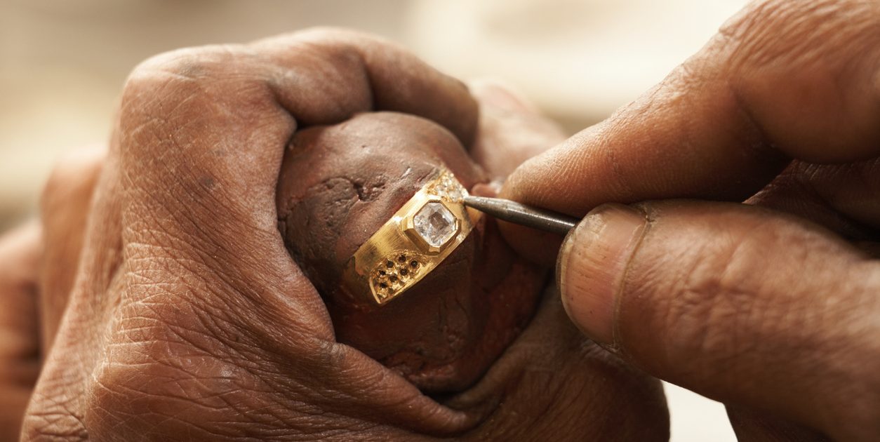 man working on old gold ring