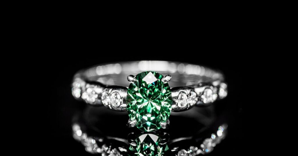 A diamond band with an emerald stone