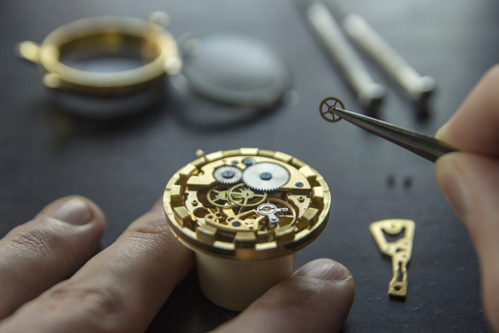 A watch being repaired by a watch repair expert